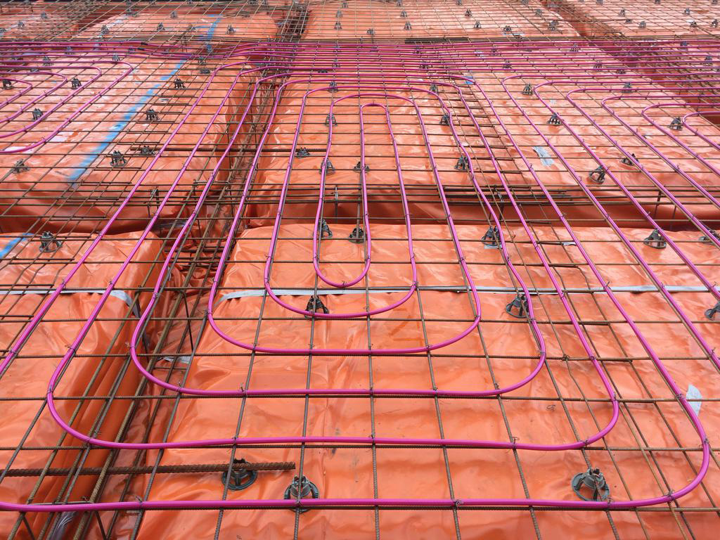 Pink hydronic heating pipes on foundation