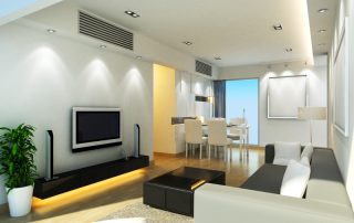 Neat, contemporary lounge room with air conditioning ducts in ceiling