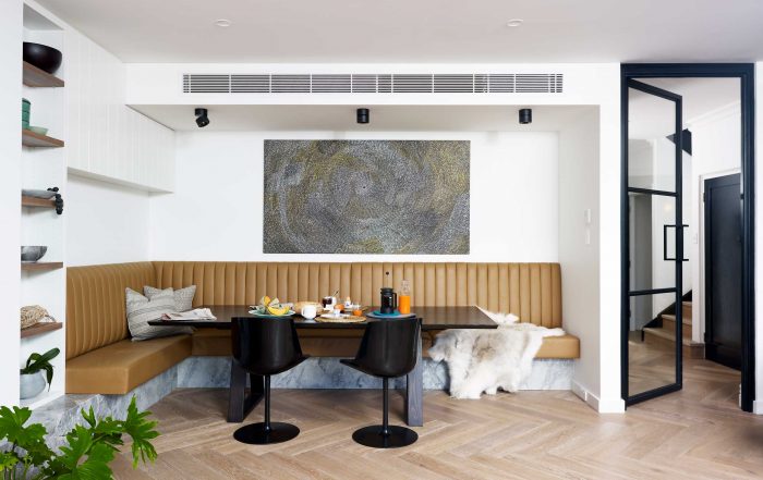 Stylish dining area with ducted reverse cycle ducts in the ceiling