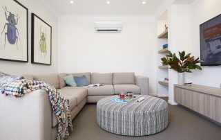 Daikin wall mounted split system in stylish lounge interior with natural tones