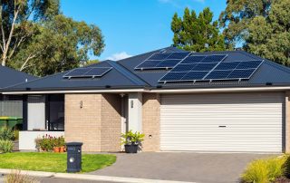 australian suburban home with solar panels on roof